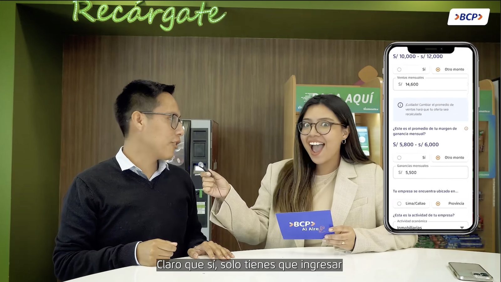 Kevin being interviewed on BCP's broadcast channel about the Mi Negocio launch, with the live loan simulator UI shown on screen beside him.
